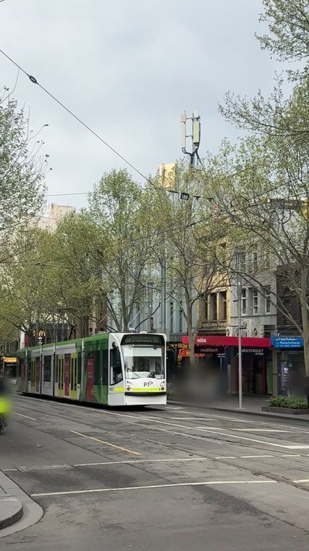 A still from the iPhone clip: a tram arriving at the same stop