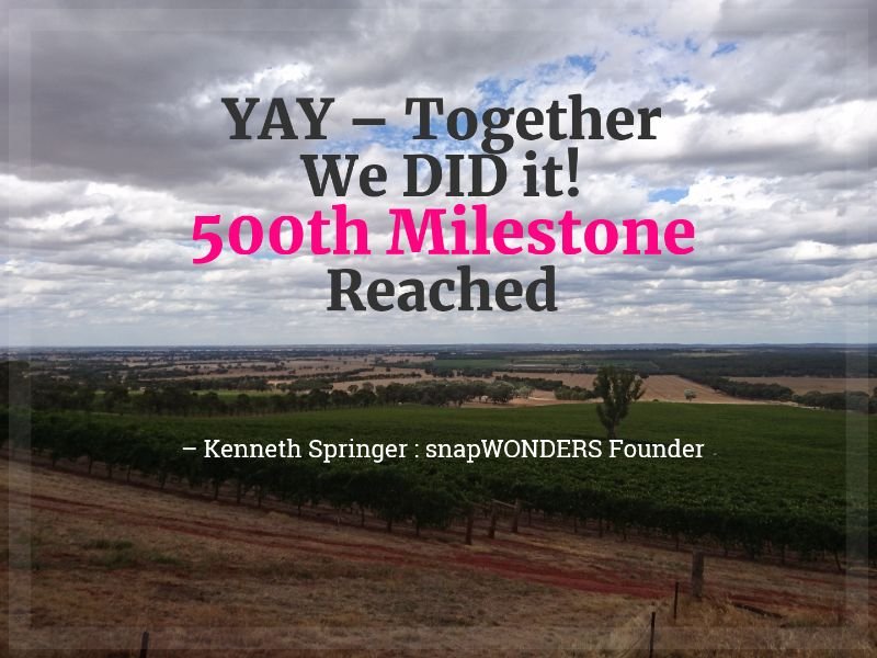 Celebration graphic reading YAY - Together We DID it! 500th Milestone Reached, over a photo of vineyard rows, credited to Kenneth Springer, snapWONDERS Founder